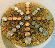 Image of an orgonite with coin in the middle