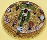 Image of an orgonite with and Esu face in the center.